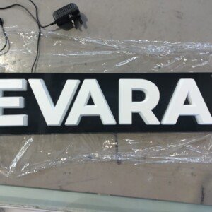 Custom neon sign with personalized text or logo on a shaped or rectangular backboard.